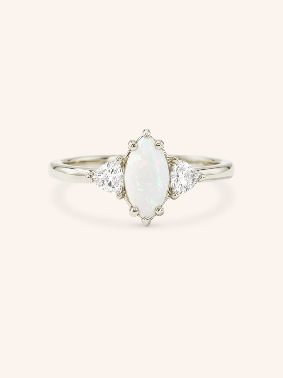 White gold Cassidy marquise opal and trillion diamond engagement ring front view on white background