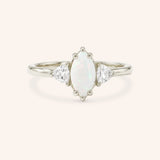 White gold Cassidy marquise opal and trillion diamond engagement ring front view on white background