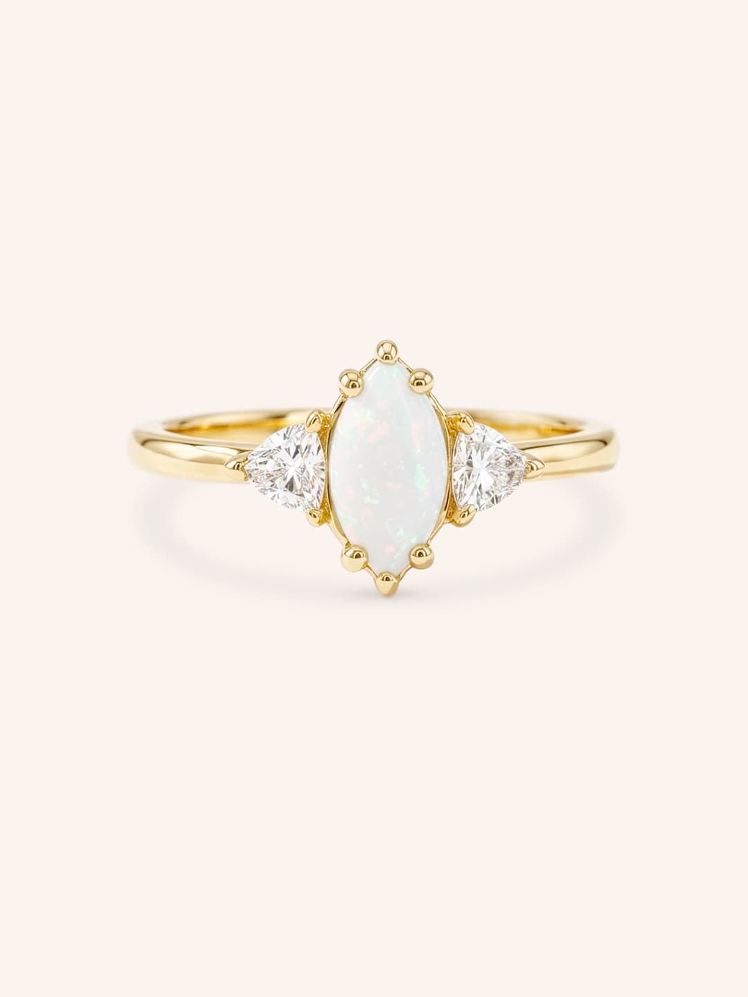 Yellow gold Cassidy marquise opal and trillion diamond engagement ring front view on white background