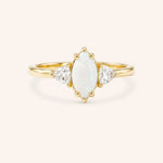 Yellow gold Cassidy marquise opal and trillion diamond engagement ring front view on white background