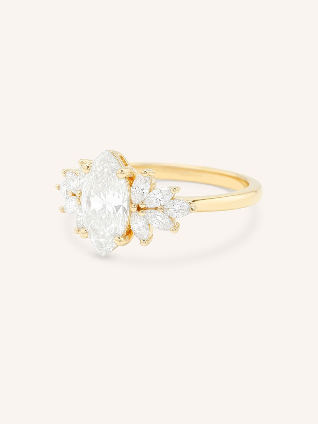 Yellow gold Emme marquise diamond cluster engagement ring side view on white background