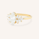 Yellow gold Emme marquise diamond cluster engagement ring side view on white background
