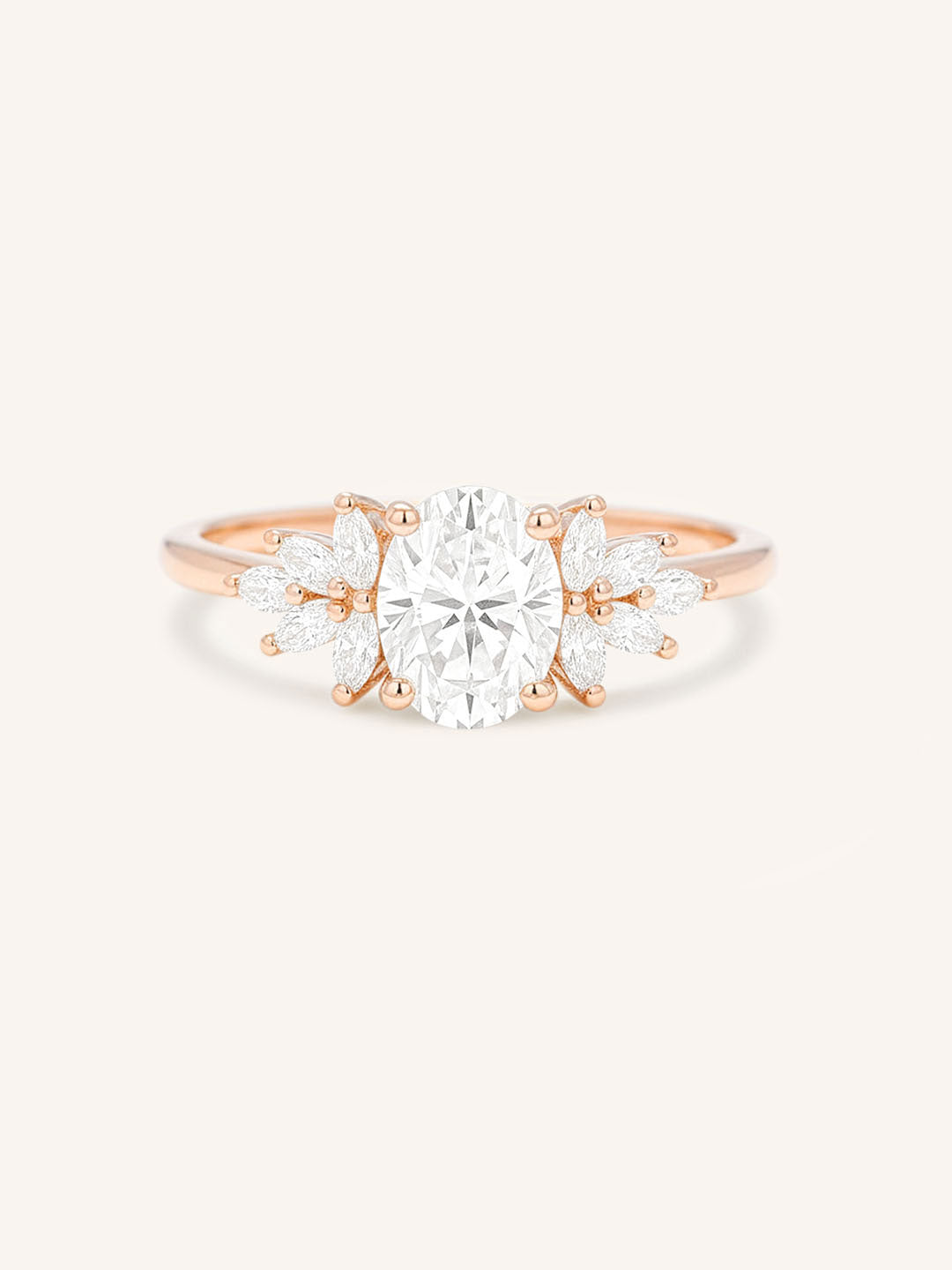 Rose gold Emme oval diamond cluster engagement ring front view on white background
