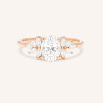 Rose gold Emme oval diamond cluster engagement ring front view on white background