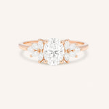 Rose gold Emme oval diamond cluster engagement ring front view on white background