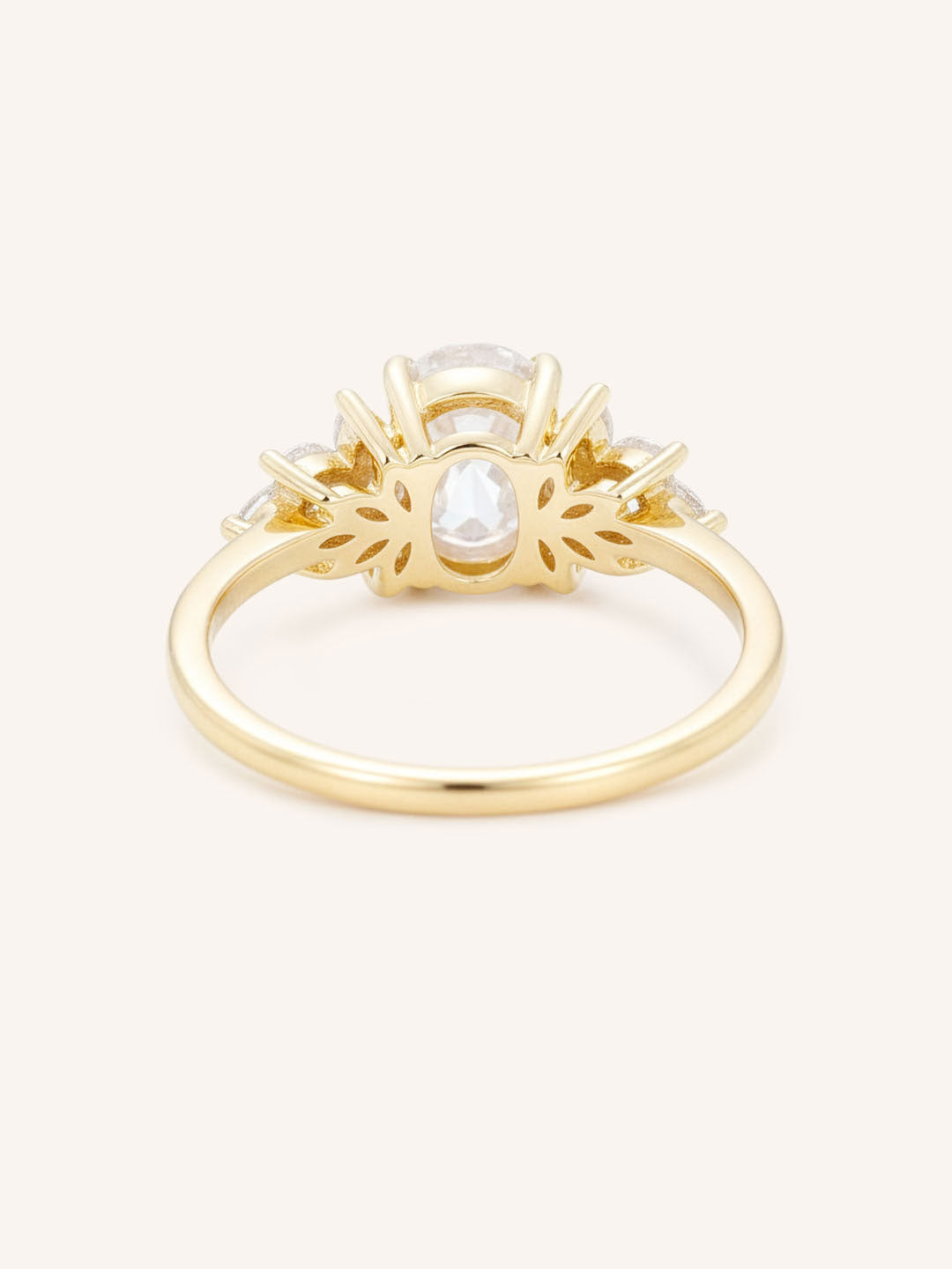 Yellow gold Emme oval diamond cluster engagement ring back view on white background