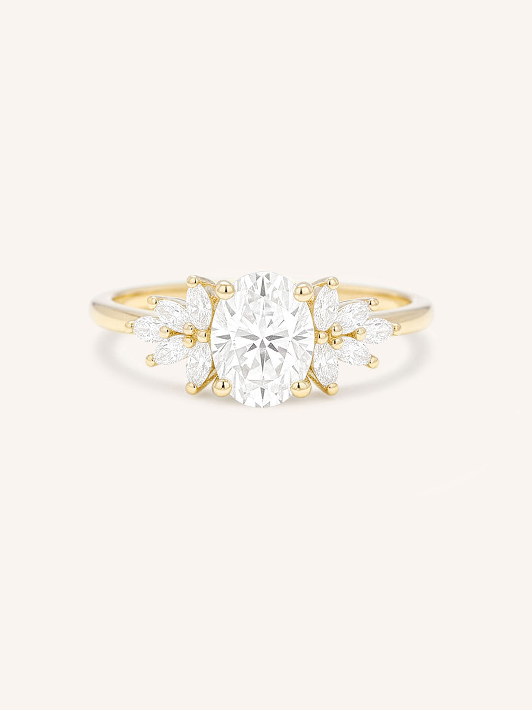 Yellow gold Emme oval diamond cluster engagement ring front view on white background