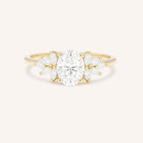 Yellow gold Emme oval diamond cluster engagement ring front view on white background