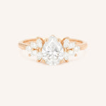 Rose gold Emme pear diamond cluster engagement ring front view on white background