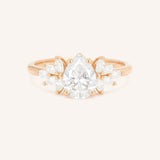 Rose gold Emme pear diamond cluster engagement ring front view on white background