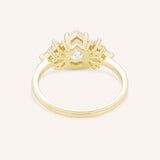 Yellow gold Emme pear diamond cluster engagement ring back view on white background