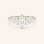 White Gold marquise diamond ring with graduated marquise and round side stones on white background