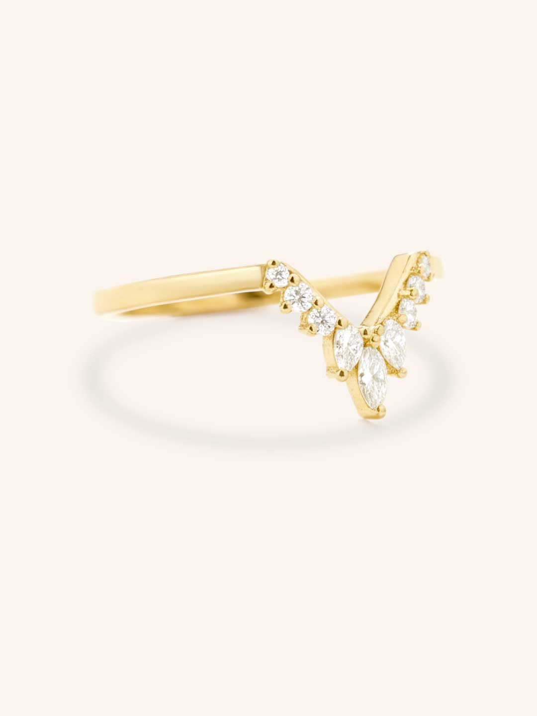 Yellow gold Joni marquise diamond V wedding ring side view on white background