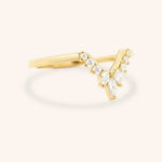 Yellow gold Joni marquise diamond V wedding ring side view on white background