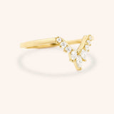 Yellow gold Joni marquise diamond V wedding ring side view on white background
