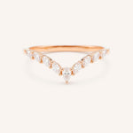 Rose gold ring with diamonds on a white background