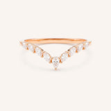 Rose gold ring with diamonds on a white background