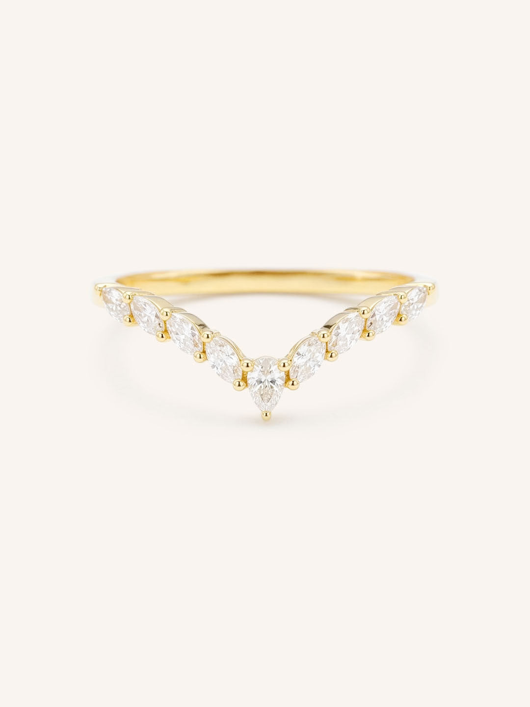 Curved Gold ring with diamonds on a white background