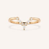 Rose gold curved diamond wedding band with V-shaped pave setting, front view, on white background