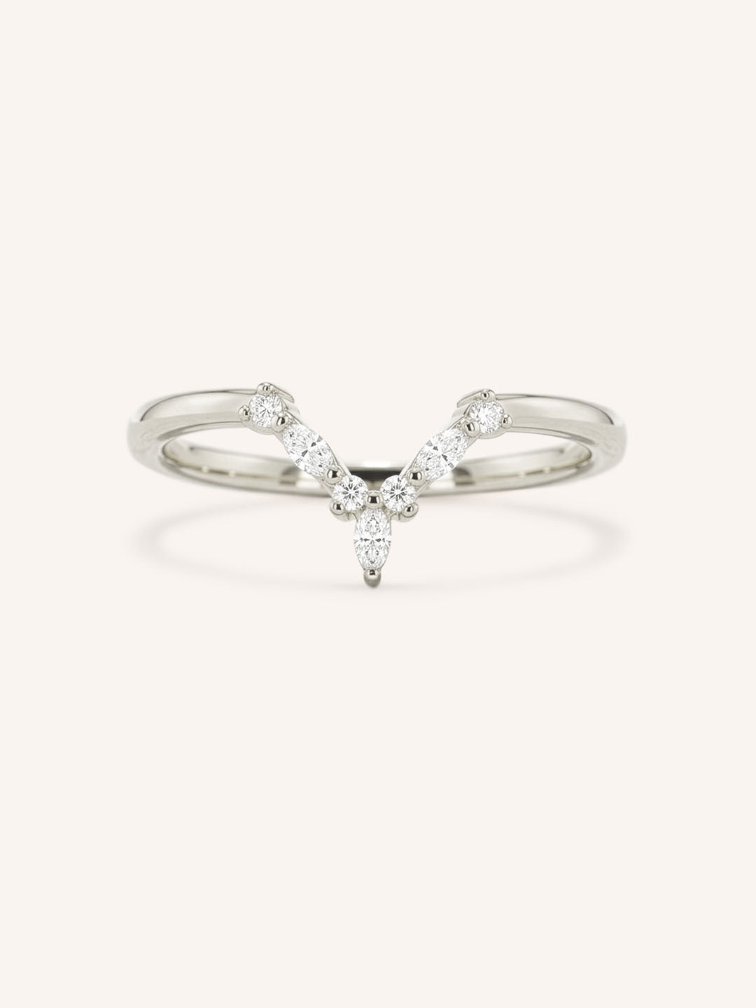 White gold curved diamond wedding band with V-shaped pave design on white background
