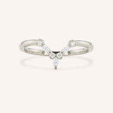 White gold curved diamond wedding band with V-shaped pave design on white background