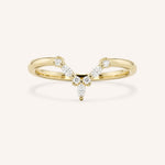 Yellow gold curved V-shaped pave diamond wedding band on white background