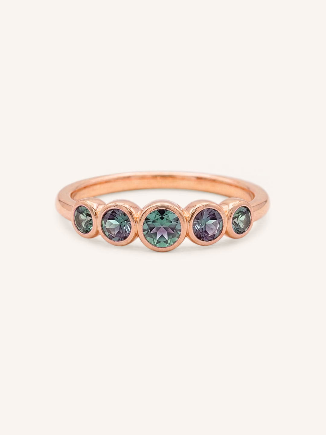 Rose gold Bonneau five stone alexandrite bezel ring front view on white background