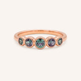 Rose gold Bonneau five stone alexandrite bezel ring front view on white background