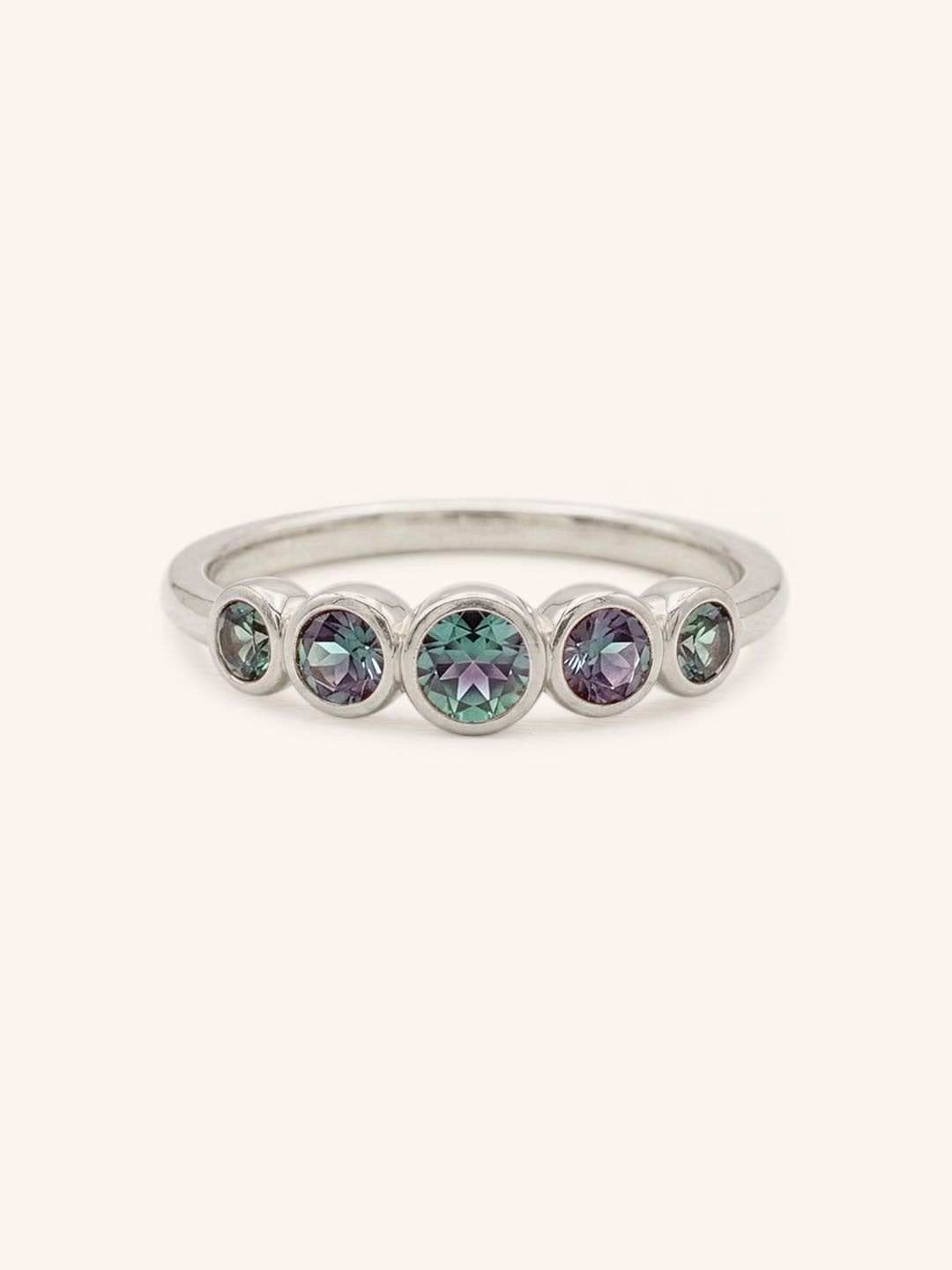White gold Bonneau five stone alexandrite bezel ring front view on white background