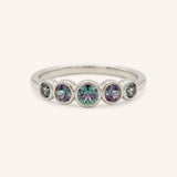 White gold Bonneau five stone alexandrite bezel ring front view on white background