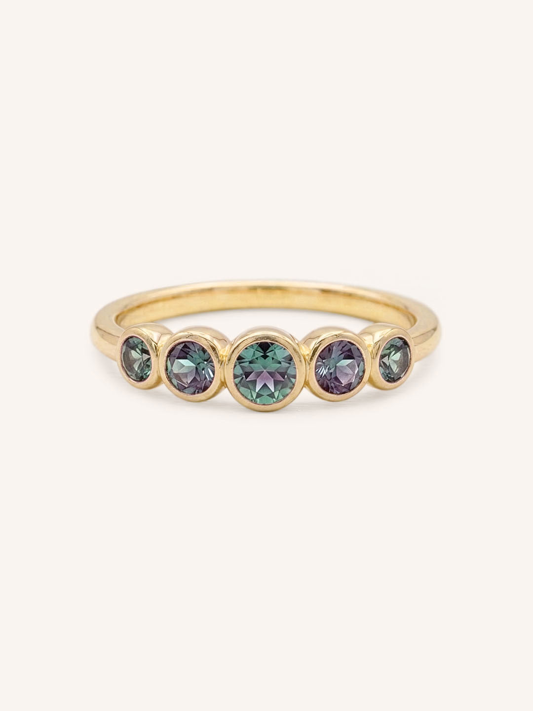 Yellow gold Bonneau five stone alexandrite bezel ring front view on white background