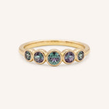 Yellow gold Bonneau five stone alexandrite bezel ring front view on white background