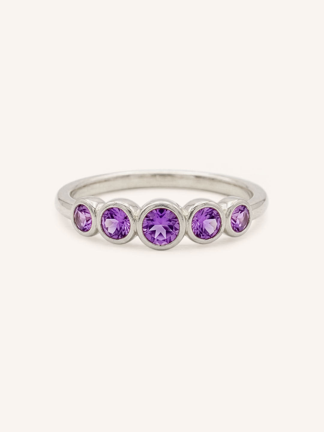 White gold Bonneau five stone amethyst bezel ring front view on white background
