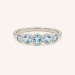 White gold Bonneau five stone aquamarine bezel ring front view on white background
