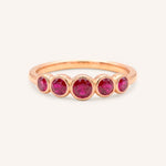 Rose gold Bonneau five stone ruby bezel ring front view on white background