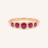 Rose gold Bonneau five stone ruby bezel ring front view on white background
