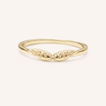 Yellow gold stackable ring with carved angel wings design, front view, on white background