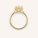 Yellow gold Jenner oval diamond solitaire engagement ring top view on white background