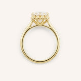 Yellow gold Jenner oval diamond solitaire engagement ring top view on white background