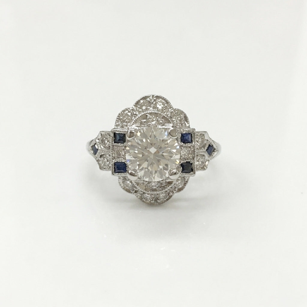 Art deco diamond bluWhite gold Alam emerald cut diamond engagement ring front view on white backgrounde sapphire ring on white background
