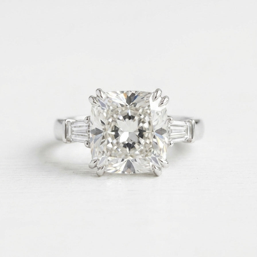 Cushion cut diamond silhouette three stone ring on white background