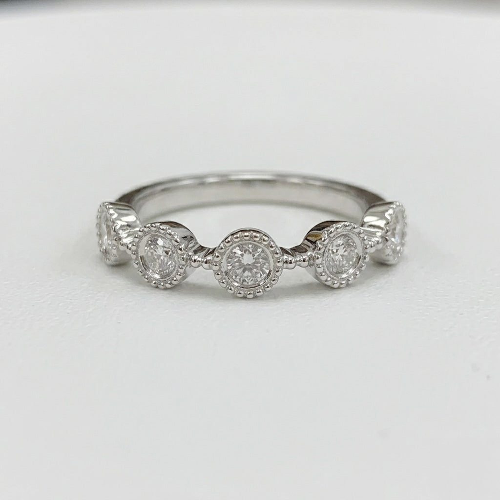 Diamond bezel milgraRose gold Alam emerald cut diamond engagement ring front view on white backgroundin band ring on white background