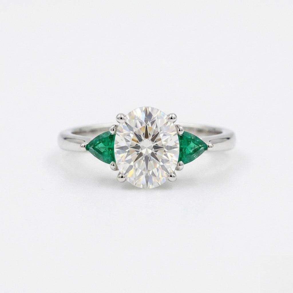 Round trillion three stYellow gold Alam emerald cut diamond engagement ring front view on white backgroundone engagement ring on white background