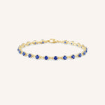 Yellow Gold Evelyn Blue Sapphire Tennis Bracelet on white background
