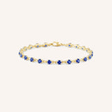 Yellow Gold Evelyn Blue Sapphire Tennis Bracelet on white background
