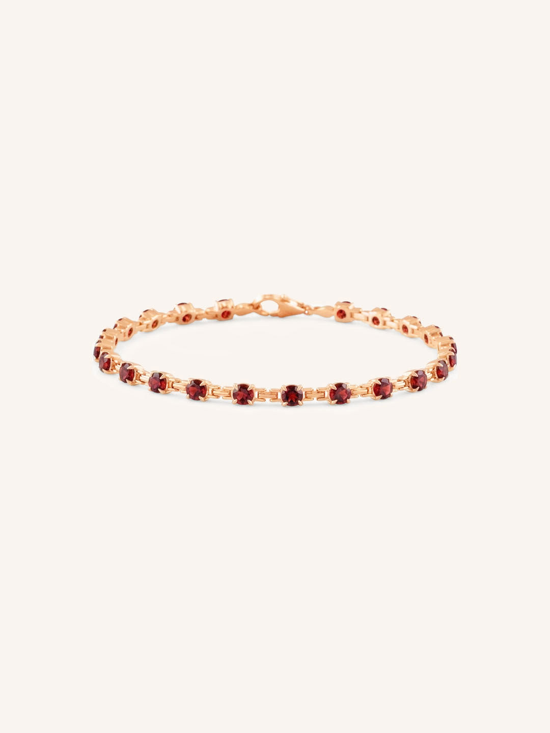 Rose Gold Evelyn Garnet Tennis Bracelet on white background
