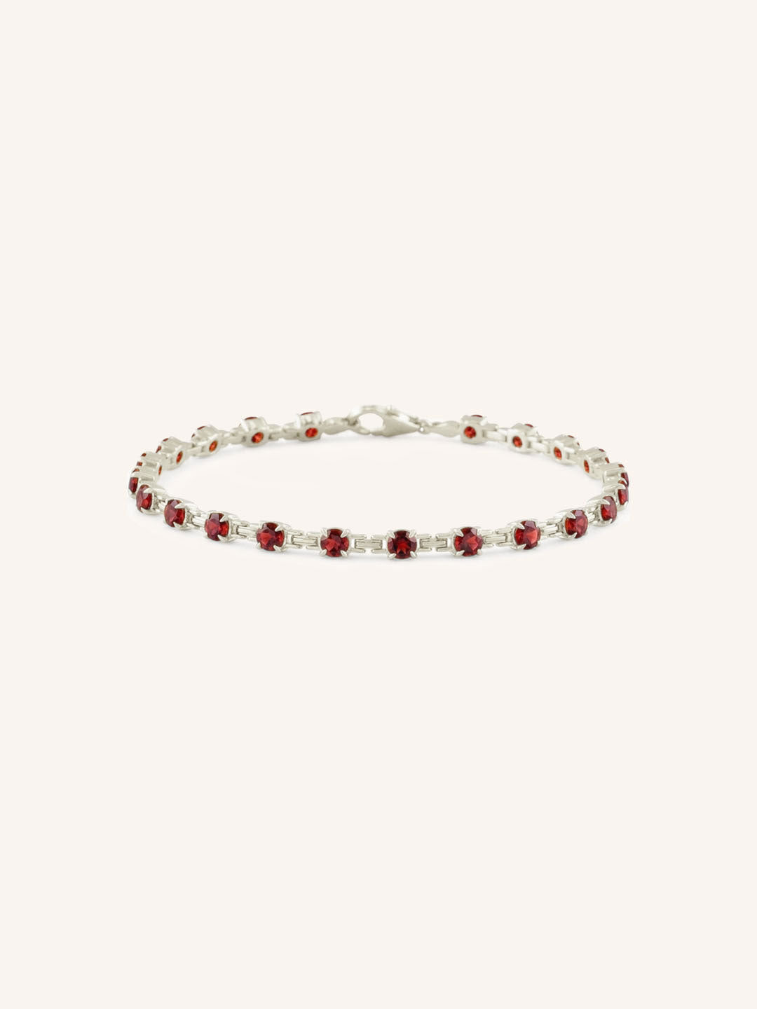 White Gold Evelyn Garnet Tennis Bracelet on white background